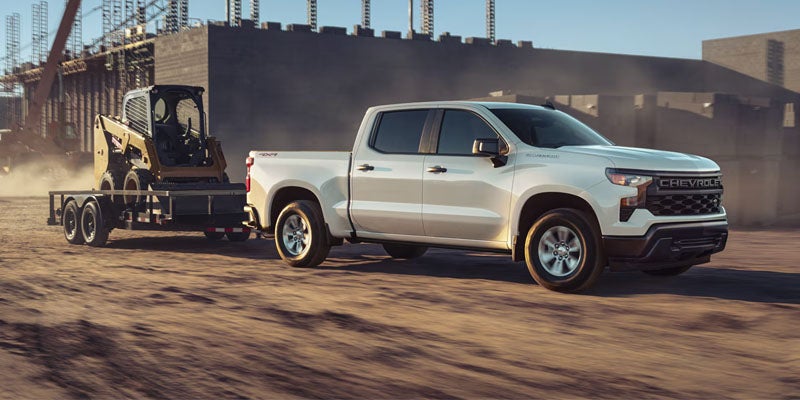 Chevy Silverado 1500 driving in dusty work site