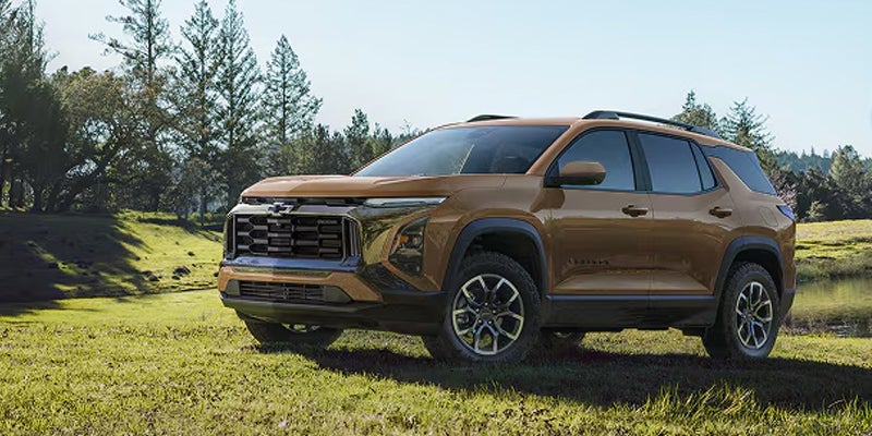 2027 gold Chevrolet Equinox on grass near trees in Belton, SC